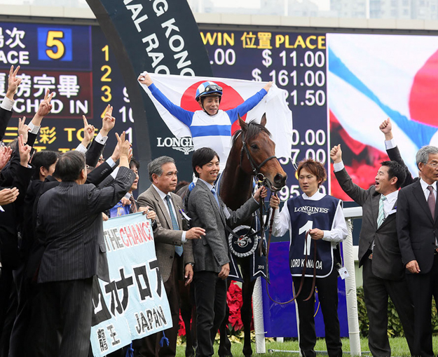 Jockey Yasunari Iwata and representatives of Lord Horse Club celebrate Lord Kanaloa's win in the 2013 LONGINES Hong Kong Sprint. Photo: The Hong Kong Jockey Club. 