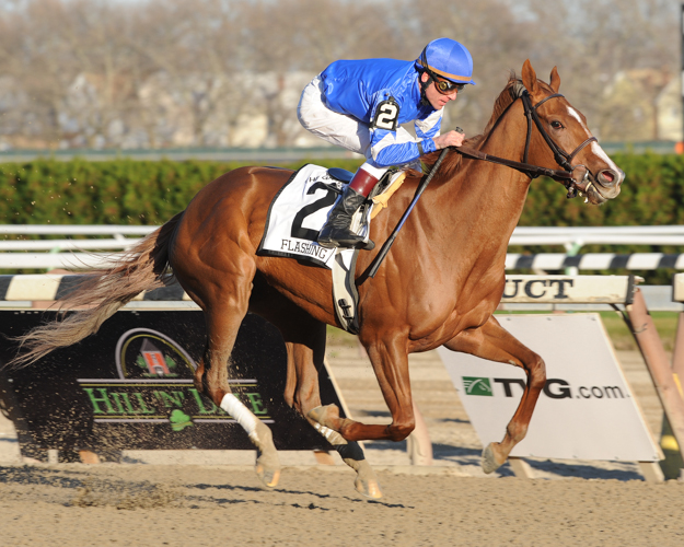 Richard Migliore and Flashing win the 2009 G1 Gazelle Stakes at Aqueduct. Photo: NYRA/David Alcosser.