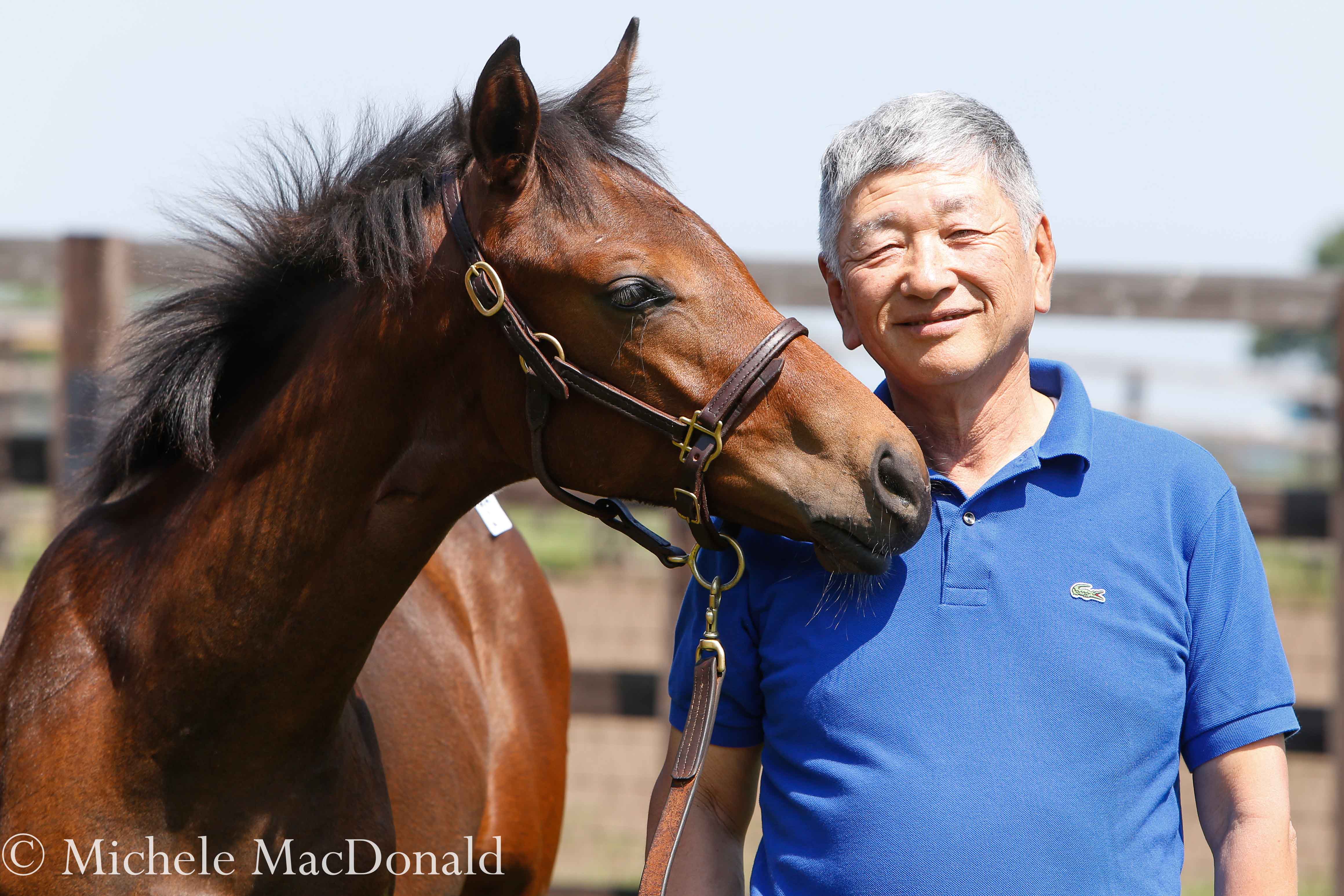 Proud consignor: Teruya Yoshida with a Kizuna colt out of Feodora consigned by his Shadai Farm. The foal went to Shinji Maeda for the equivalent of $789,000. Photo: Michele MacDonald