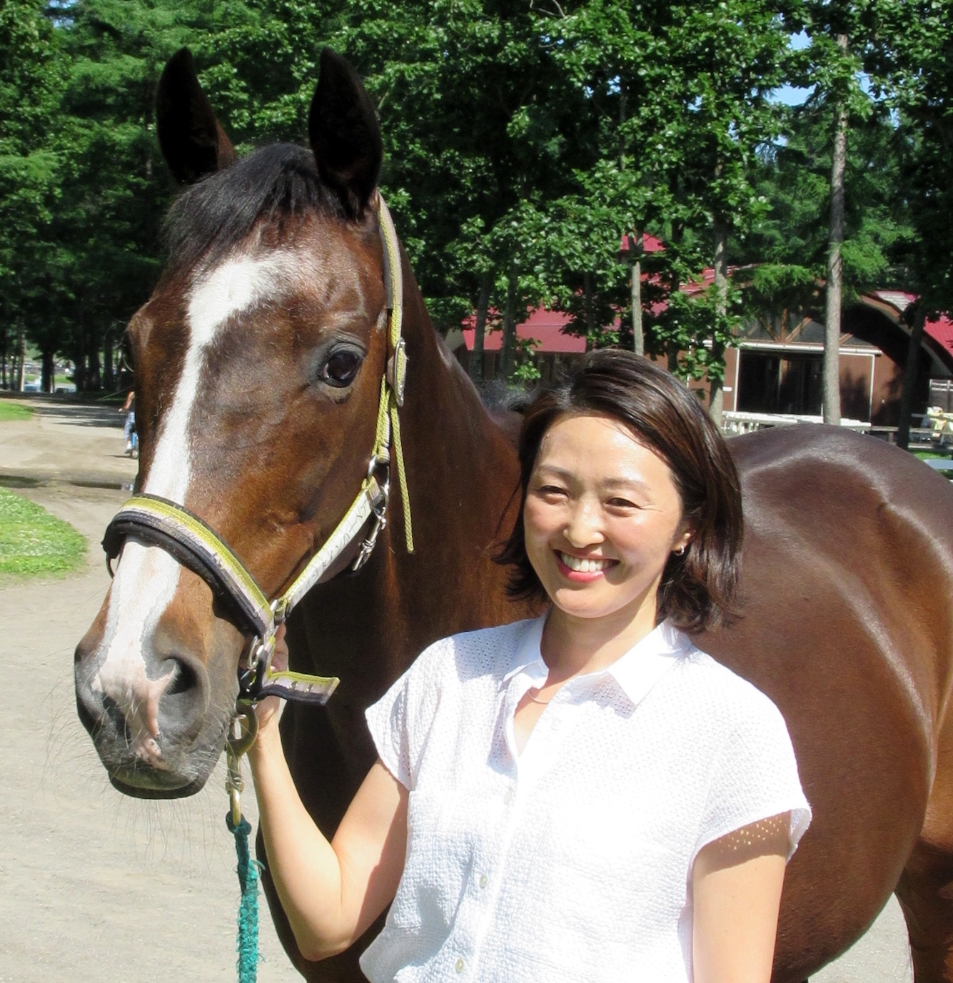 Sharing the family treasure: Wind In Her Hair, dam of Deep Impact, is popular with visitors to Northern Horse Park. She is pictured there with Akiko Yonemoto, NHP director and daughter of its founder, Katsumi Yoshida. Photo: Amanda Duckworth