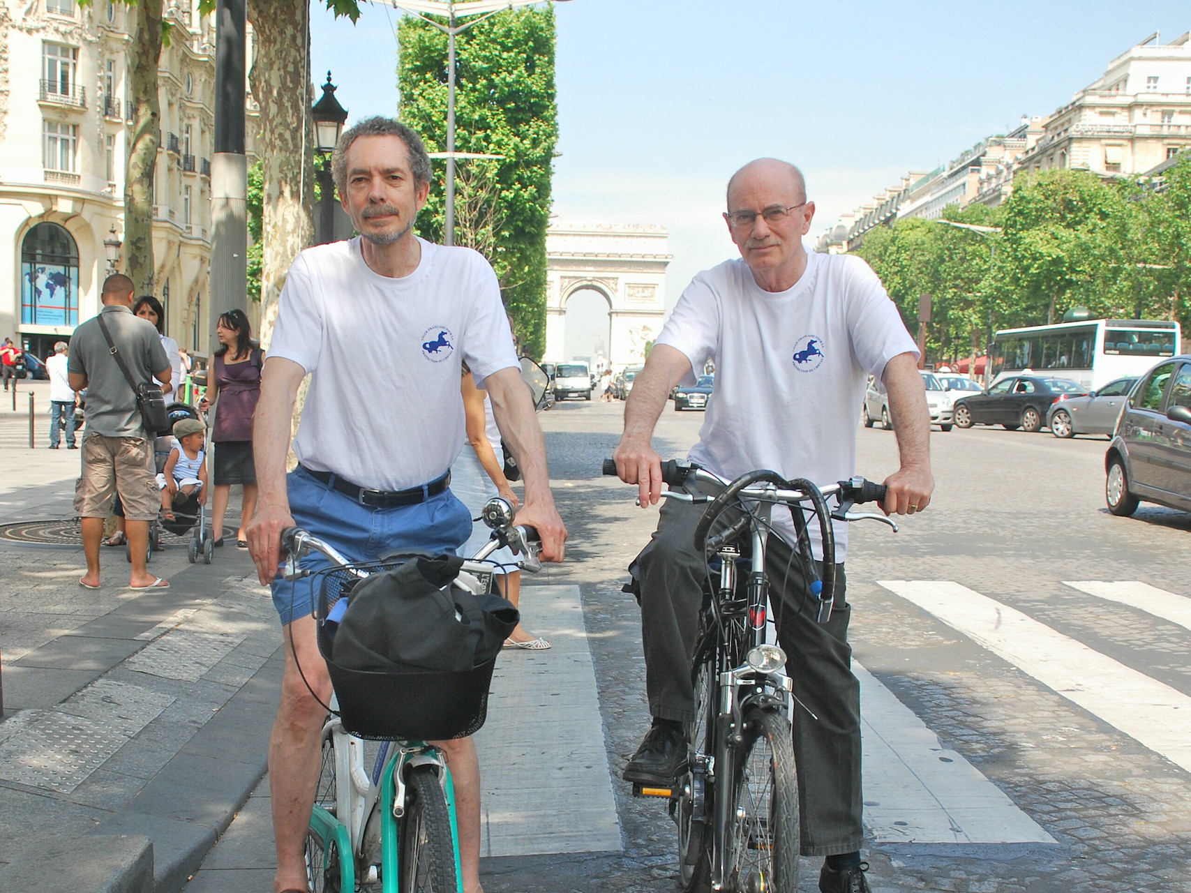Intrepid duo: Cramer (right) with Alan Kennedy on the Champs Elysees in Paris during their marathon charity bike ride. Photo: John Gilmore