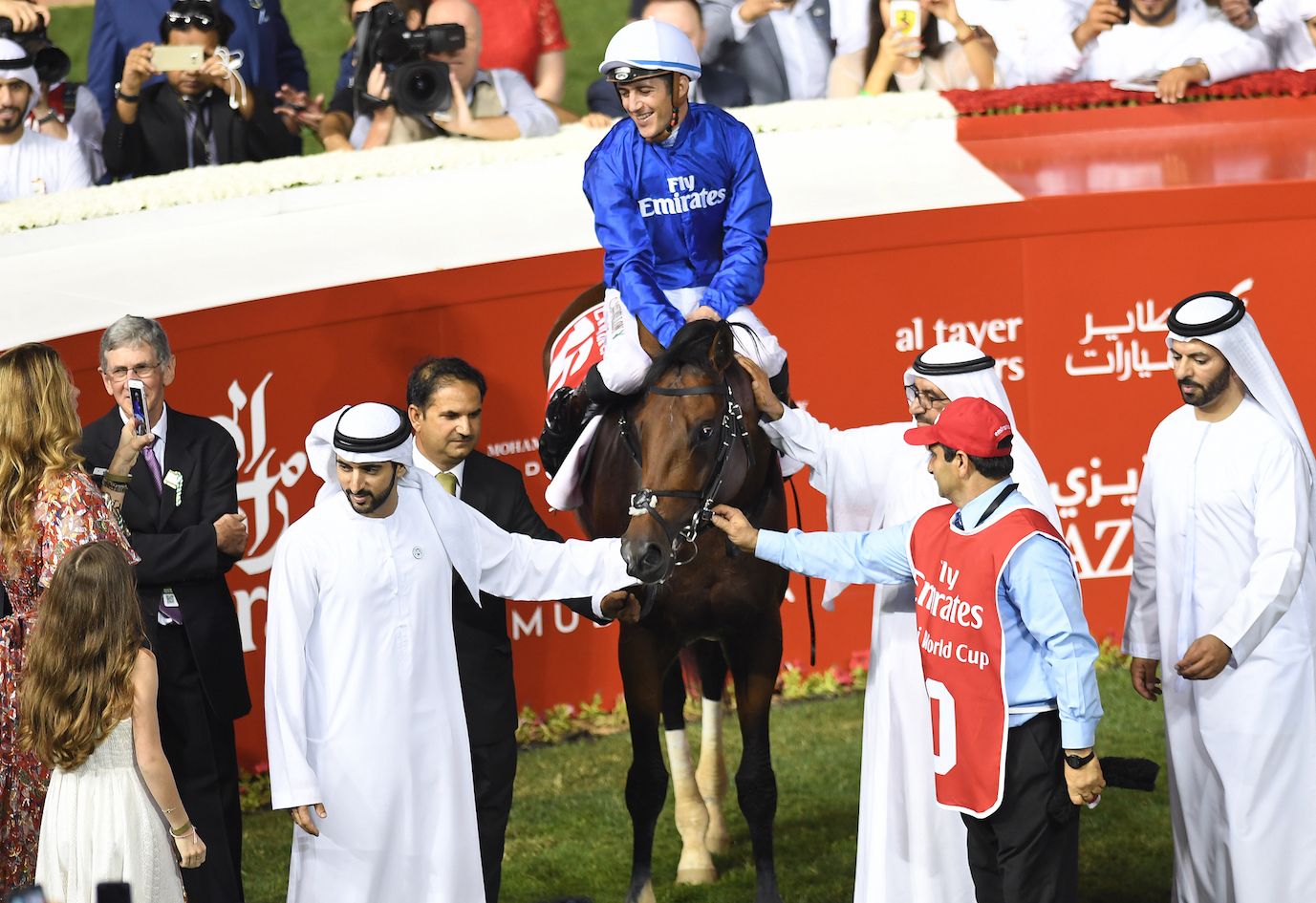 Christophe Soumillon enjoys the moment as Thunder Snow is feted in the winners’ enclosure after the race. Saeed Bin Suroor is on the right. Photo: Dubai Racing Club