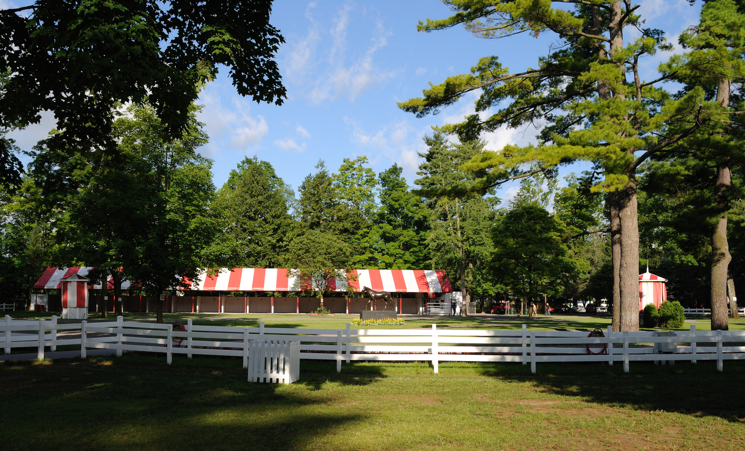 The red-and-white striped canopied saddling shed at Saratoga today. It was added in 1977. Image courtesy Turnberry Consulting