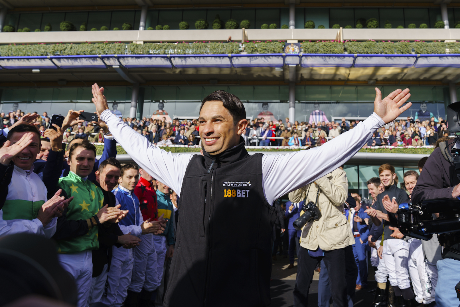 Hail a hero: the crowd - and a guard of honour from his fellow jockeys - saluting 2017 champion Silvestre De Sousa on Qipco British Champions Day. De Sousa is sure to retain his crown this season