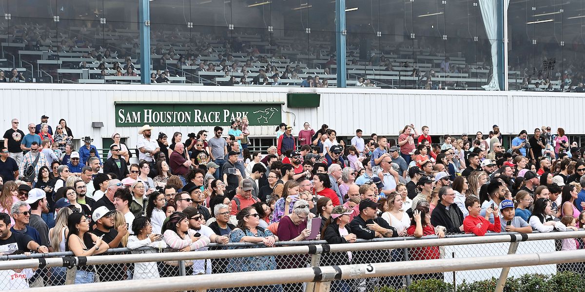 On the rails: the crowd follows the action at Sam Houston Race Park, set to host Texas Champions Day card on March 23. Photo: Coady Photography