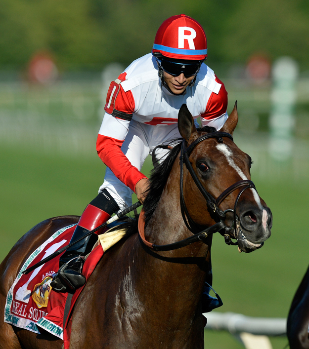 Real Solution and jockey Alan Garcia in the 2013 Arlington Million. Photo: AP/Brian Kersey.