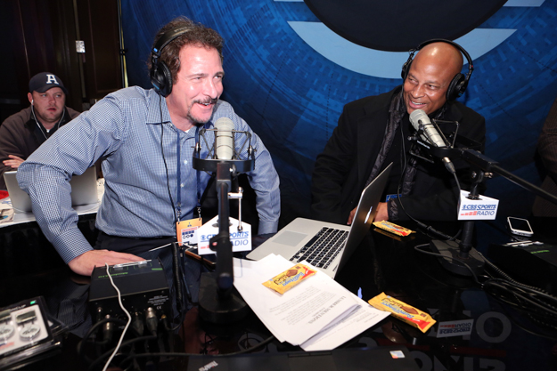 Jim Rome talks to NFL legend Ronnie Lott on "The Jim Rome Show" broadcast on CBS Sports Radio. Photo: Casey Rodgers/Invision for Butterfinger Peanut Butter Cups/AP Images. 