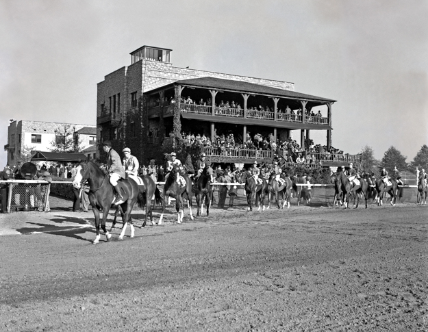 Horses parading on the track in front of the Keeneland clubhouse, circa 1940. Photo: Keeneland Library.