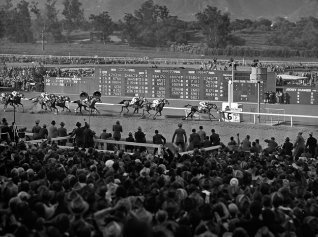 The Library frequently receives requests for copies of photographs from its collections. This photo by Bert Morgan captures Seabiscuit winning the 1940 Santa Anita Handicap. Photo via Keeneland Library/Morgan Collection.