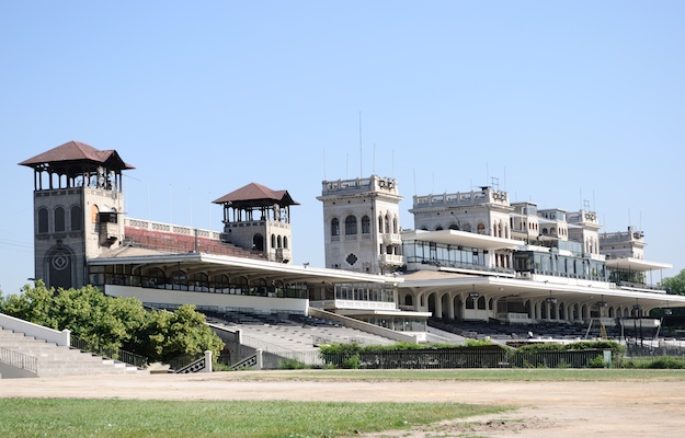 Trackside panorama, the public stand in foreground and Members' Stand in the background.  Photo via Isabelle Taylor