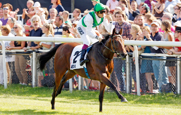 Sea The Moon, Christophe Soumillion up, after winning the German Derby. Photo: RacingFotos.com