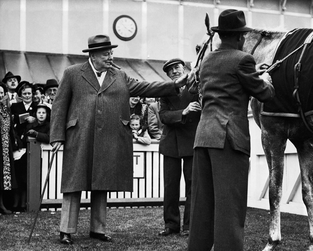 Churchill gives Colonist II a pat after winning the Winston Churchill Stakes at Hurst Park on May 14, 1951. Photo: AP Photo/Don Royale