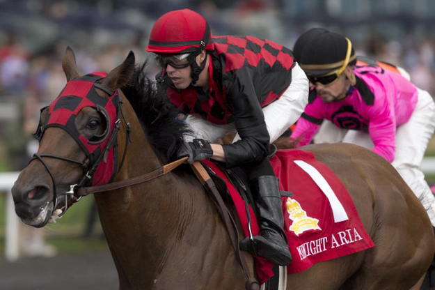 Jockey Jesse Campbell guides Midnight Aria to victory in the 2013 Queen's Plate at Woodbine. Photo: Michael Burns.
