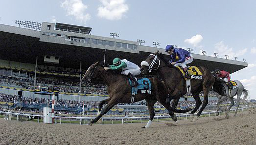 Emma-Jayne Wilson, aboard Mike Fox, becomes the first female jockey to win the Queen's Plate. Photo: Michael Burns Photo.