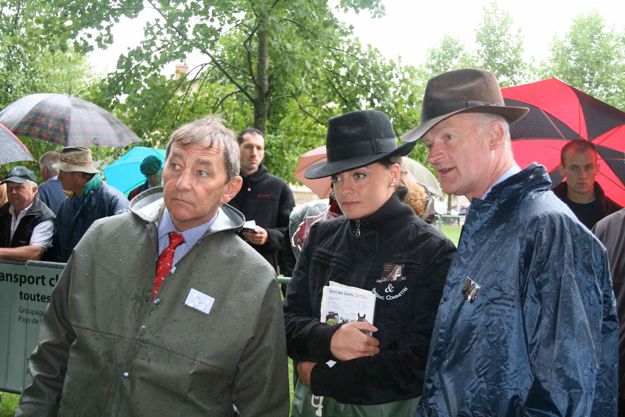 Ferdy Murphy, FRBC's Capucine Houel, and Willie Mullins (left to right), challenging the rain to deliver their judgement at the 2011 Decize show‏. Photo: Laurence Salphati.