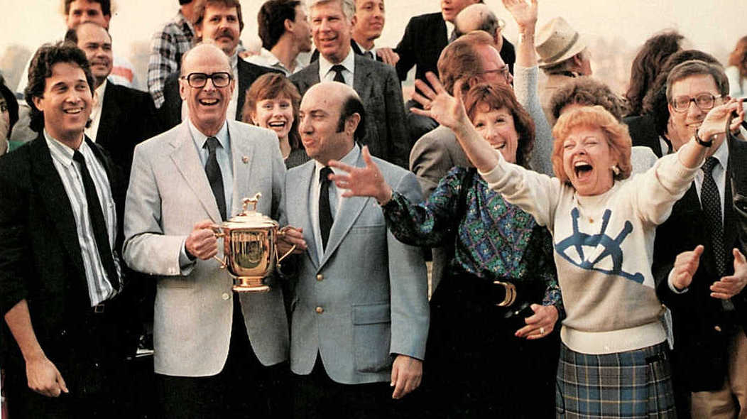 Sheer joy: some of Martial Law’s connections celebrate as Jeff Siegel (centre) is presented with the trophy by Santa Anita Park president Robert Strub. Photo: Team Valor International