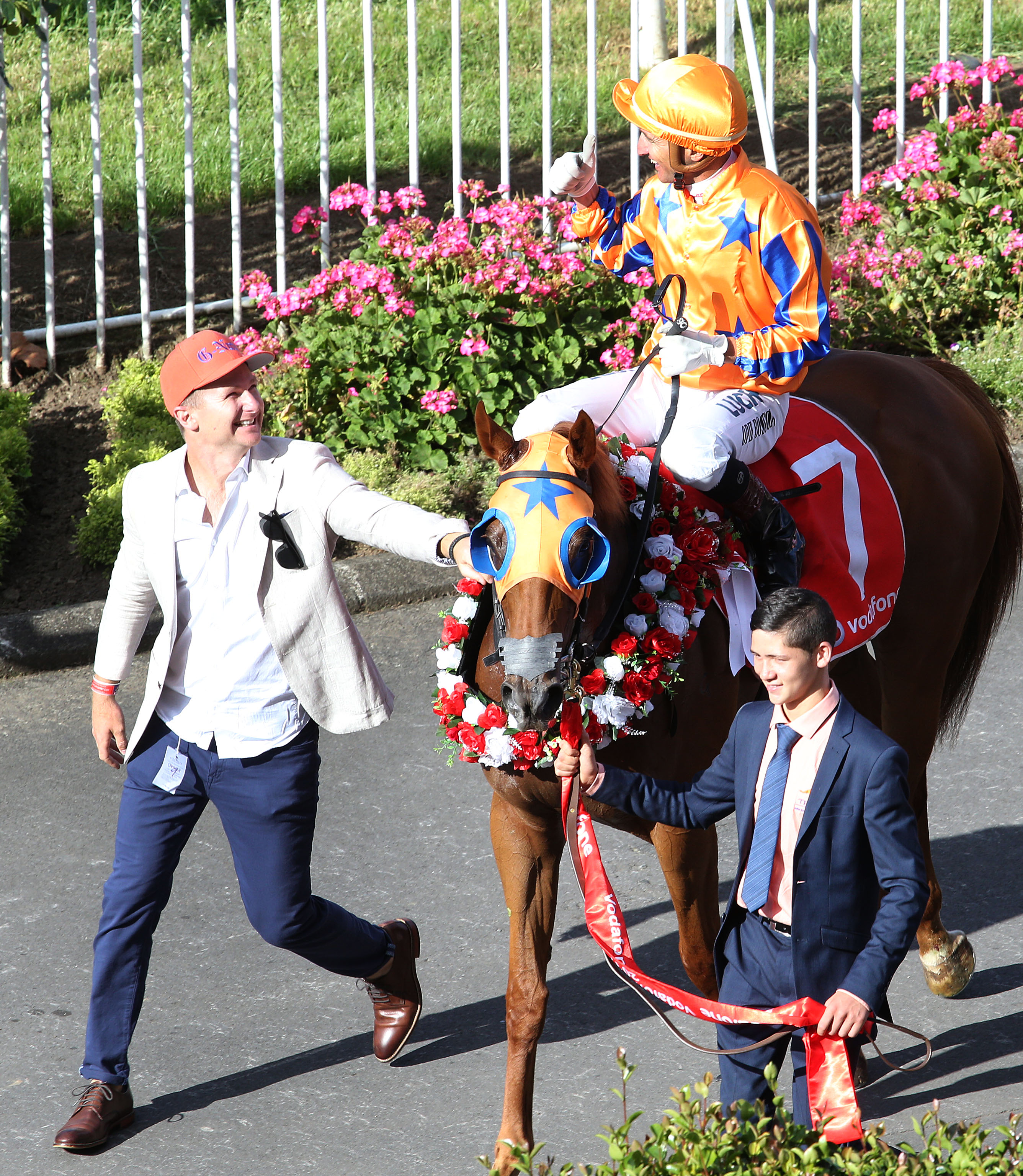 Blair Alexander with Gingernuts and jockey Opie Bosson after their New Zealand Derby triumph. Photo: Trish Dunell