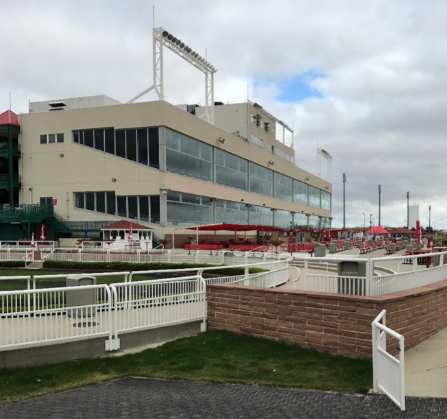 Making an effort: Prairie Meadows’ clubhouse and apron with tables and benches, including canopies