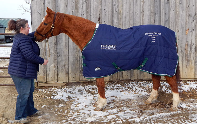 'Markie' and that blanket: he is pictured with Bright Futures volunteer Heather Skokowski. Photo: Bev Dee