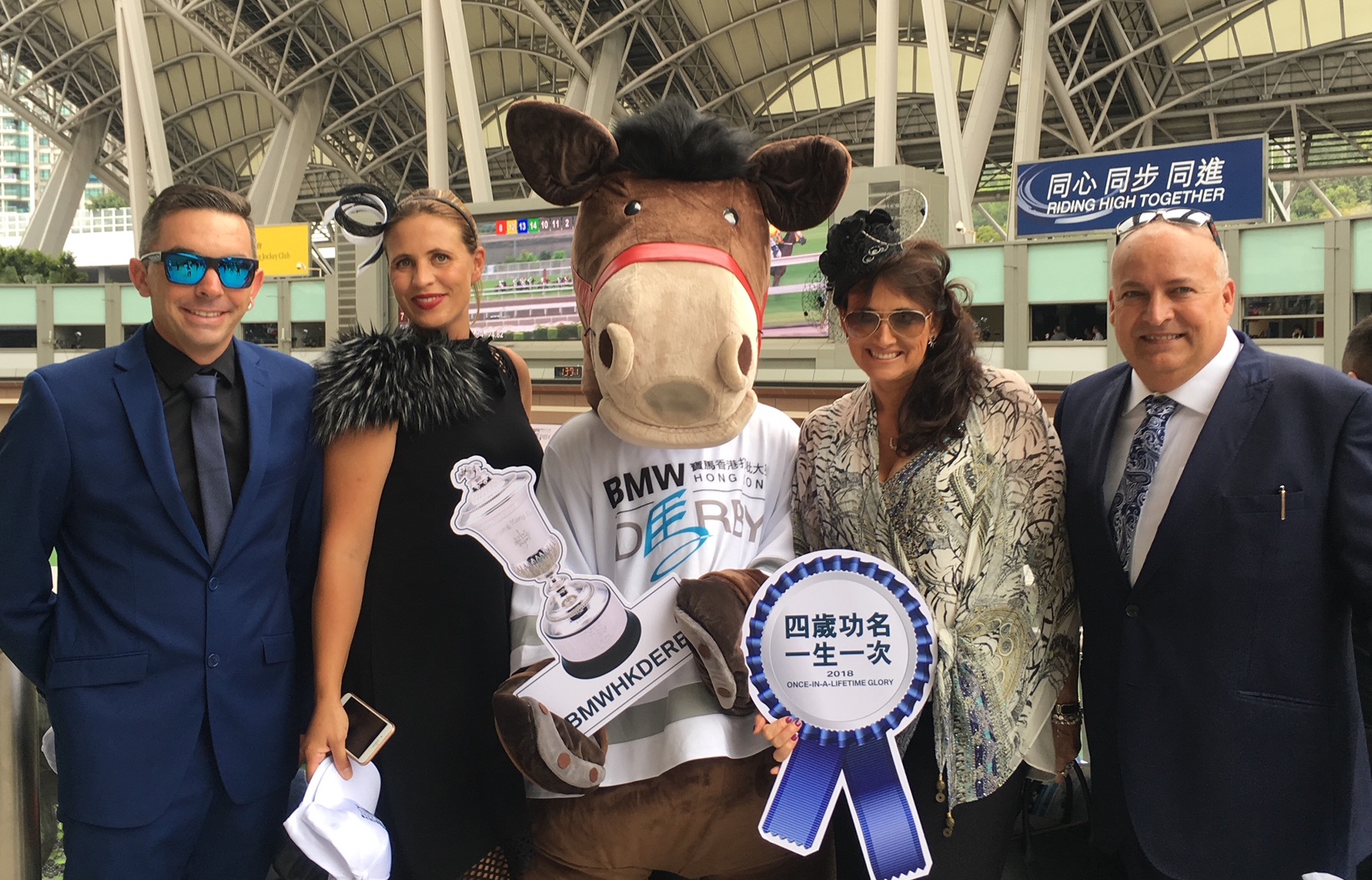 Highden's Sam and Libby Bleakley (left) and breeders Lisa and Glenn Morton on track at Sha Tin to watch Ping Hai Star win the Hong Kong Derby