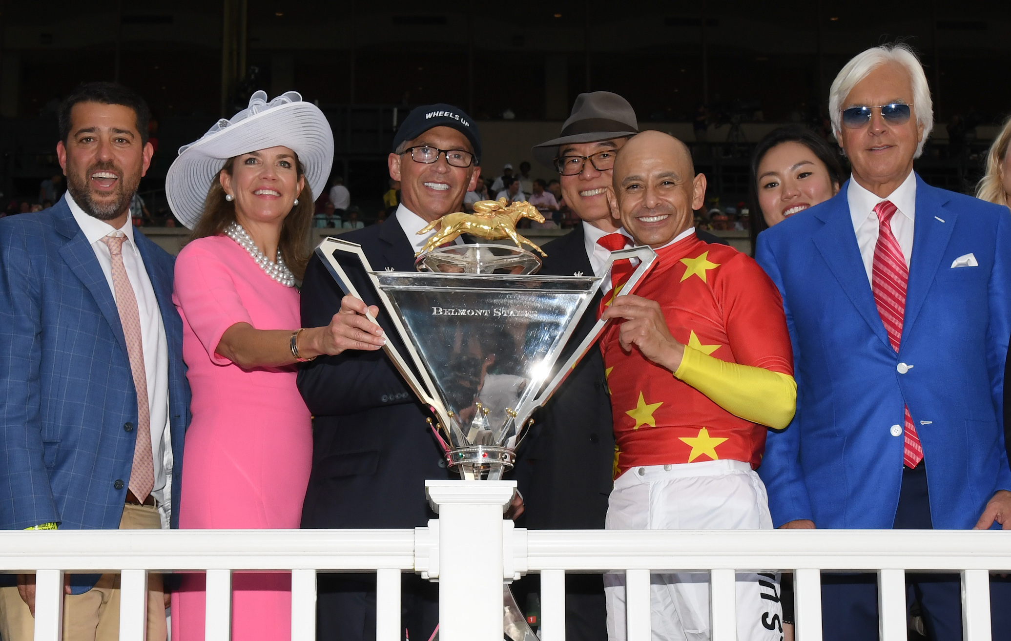 That winning feeling: ownership partners Sol Kumin (Head of Plains Partners), Lisa and Kenny Troutt (WinStar Farms) and Teo Ah Khing (China Horse Club) with Mike Smith and Bob Baffert - and the Belmont trophy. Photo: Adam Conglianese/NYRA.com