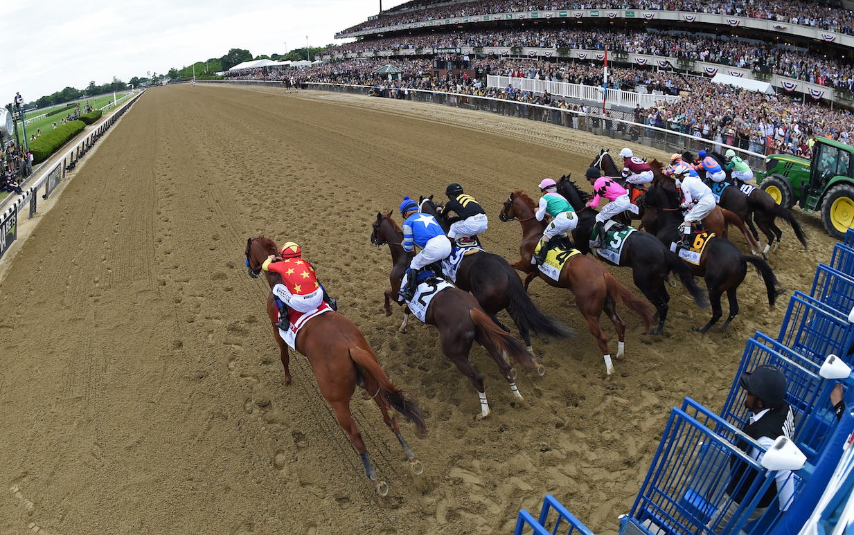 Go for it: Mike Smith galvanizes Justify (left) as soon as the gates open, rushing him up the inside and straight into the lead. Photo: Adam Mooshian/NYRA.com