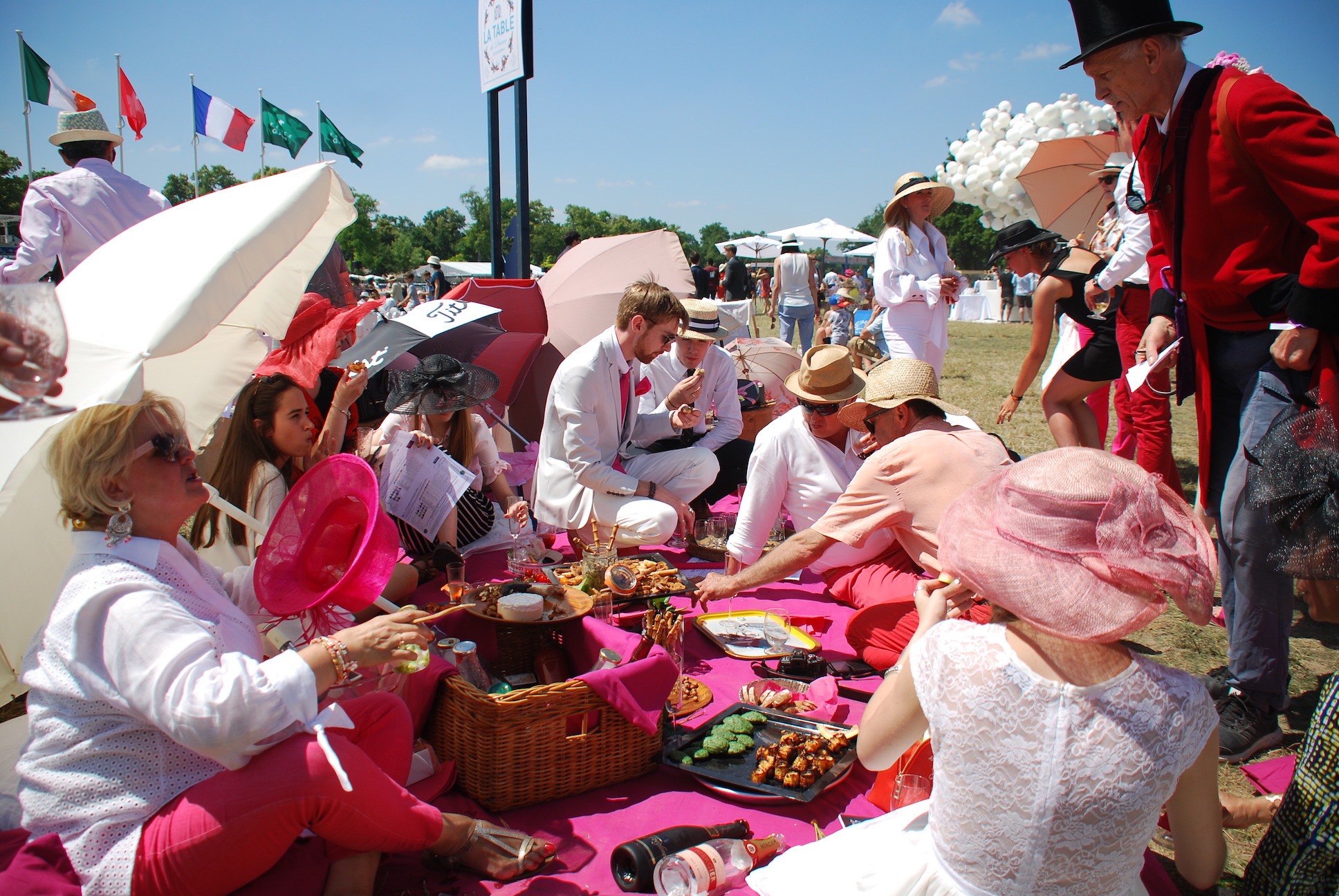 Picnicking in the sunshine on the Pelouse in front of the racecourse on Prix de Diane day. Photo: John Gilmore