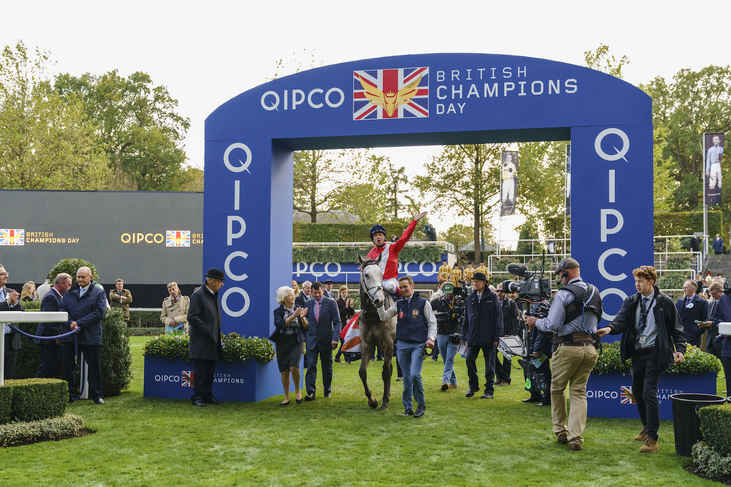 The place to be: Frankie Dettori on the John Gosden-trained, Cheveley Park Stud-owned Persuasive is welcomed into the winner’s enclosure after last year’s Queen Elizabeth II Stakes