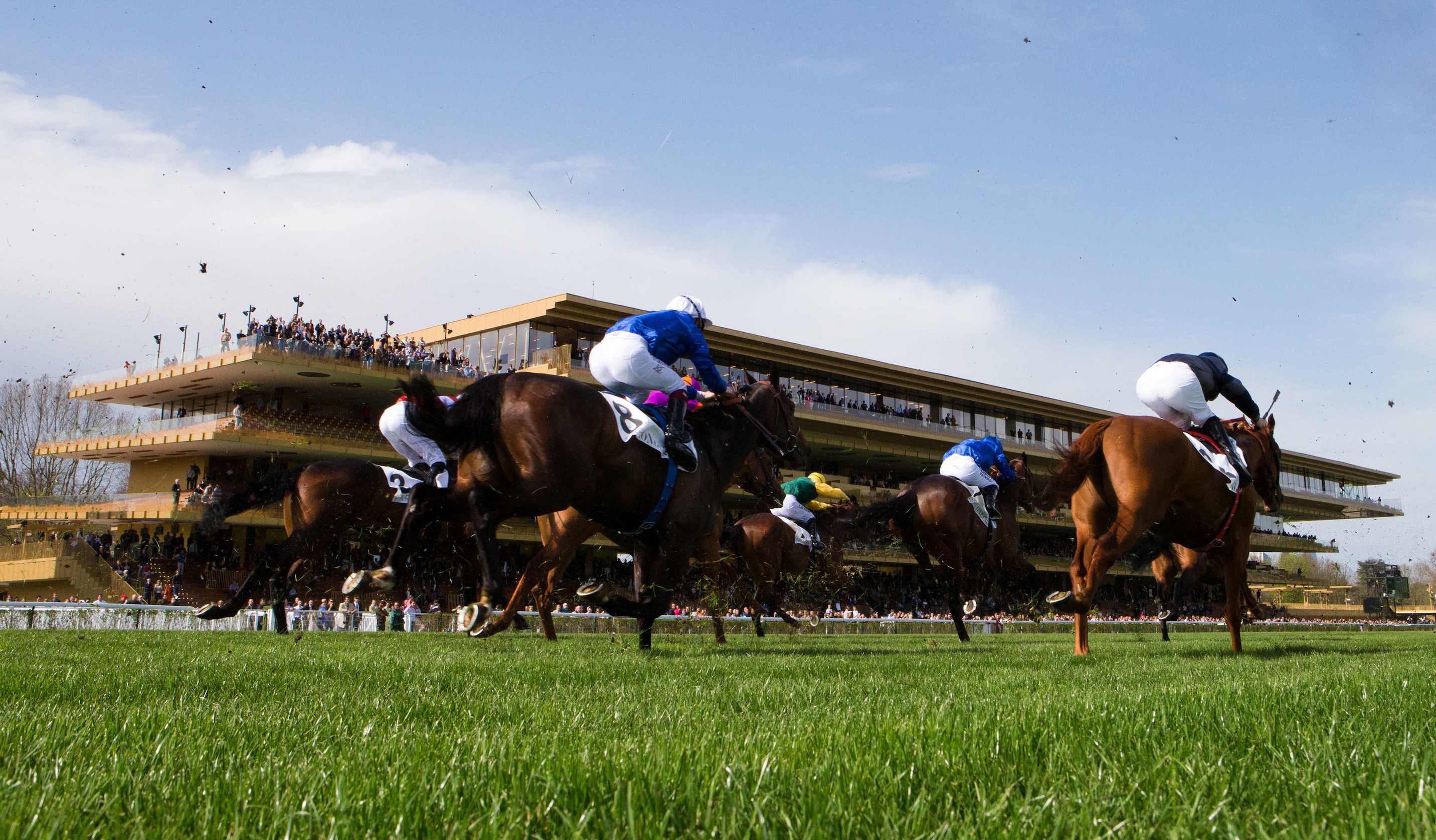 The runners are driven out up the home straight in front of cheering racegoers. But is the crowd so far from the action that the atmosphere appears muted? Photo: ScoopDyga