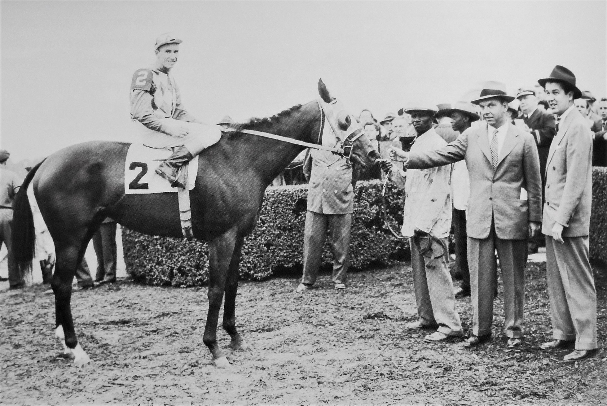 Bed o’ Roses with jockey Eric Guerin, trainer Bill Winfrey and owner Alfred G. Vanderbilt