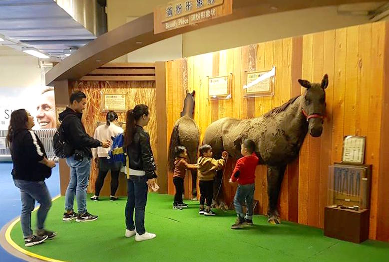 In the ‘Beauty Place’, fans can take photos of themselves brushing a stabled horse or pretending to be a jockey as they stand over a photo of breeches (below). Photos: Kristen Manning