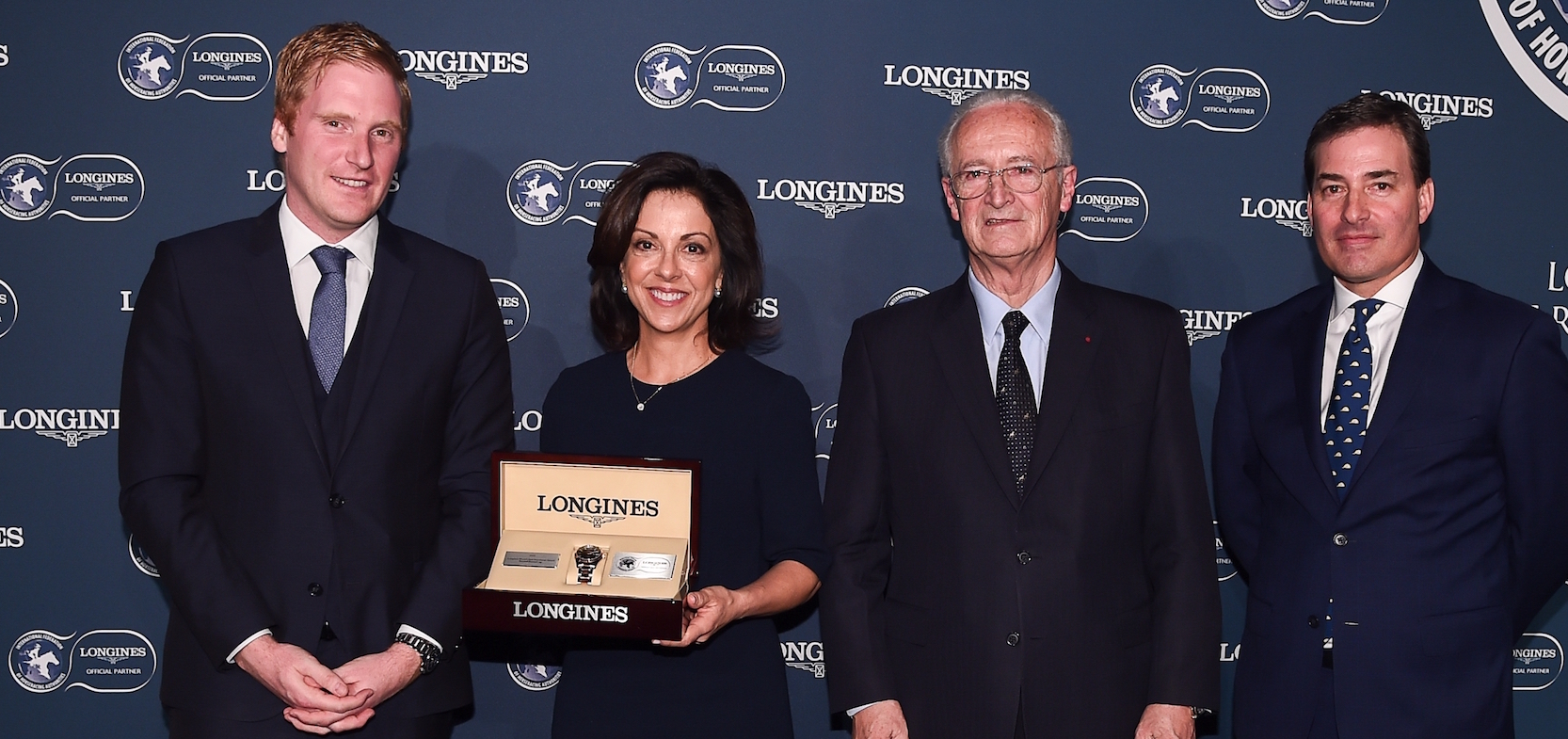 Accelerate's co-owner Stephanie Hronis receives the award for third best racehorse in the world at the Longines ceremony in London yesterday. She is pictured with, from left, Benjamin Aeby (Longines International Sponsorship & Events Manager), Louis Romanet (chairman of the International Federation of Horseracing Authorities) and Jim Gagliano (IFHA vice-chairman). Photo: Longines