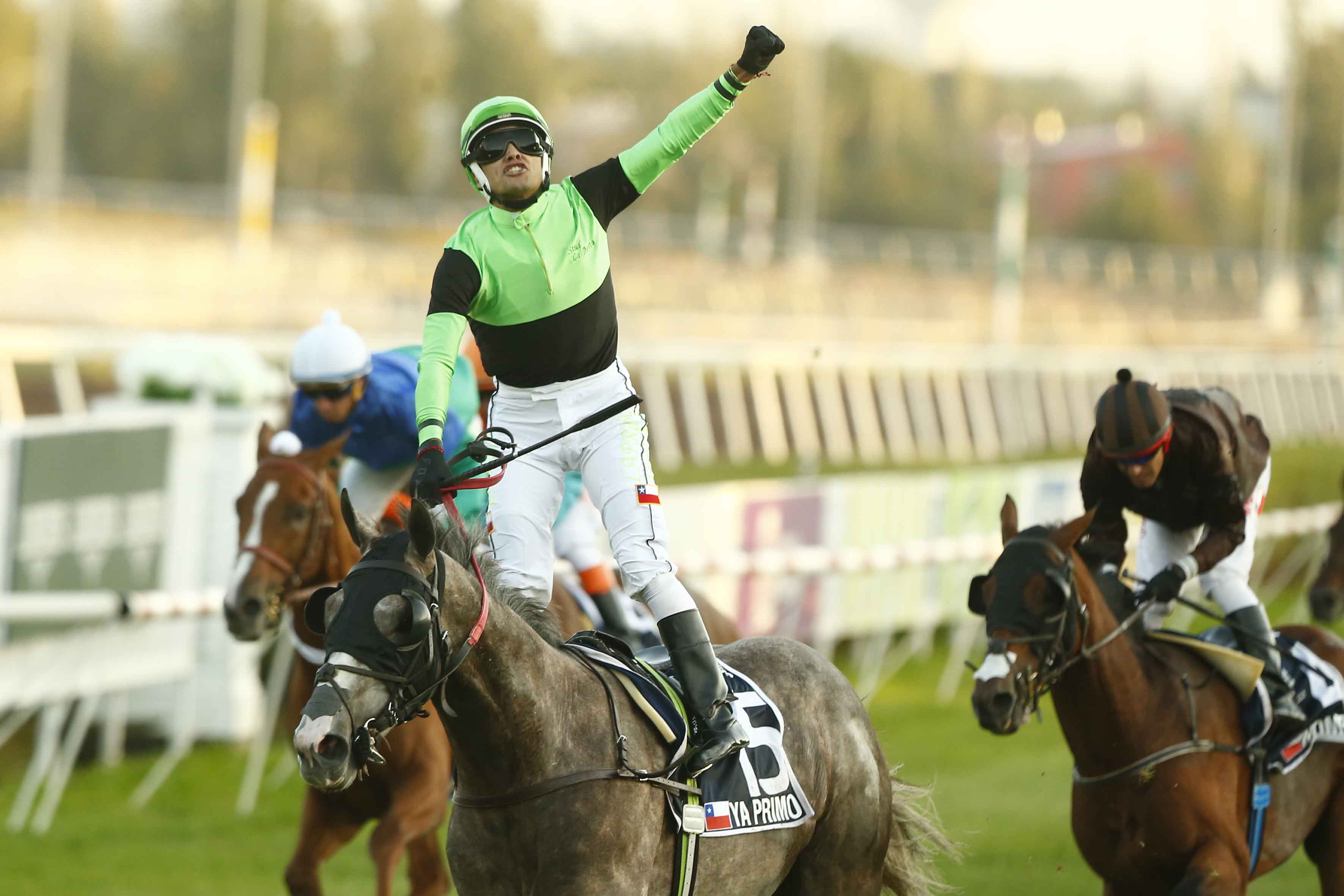 Basking in victory: jockey Jeremy Laprida enjoys the moment as Ya Primo crosses the line. Photo: Club Hipico