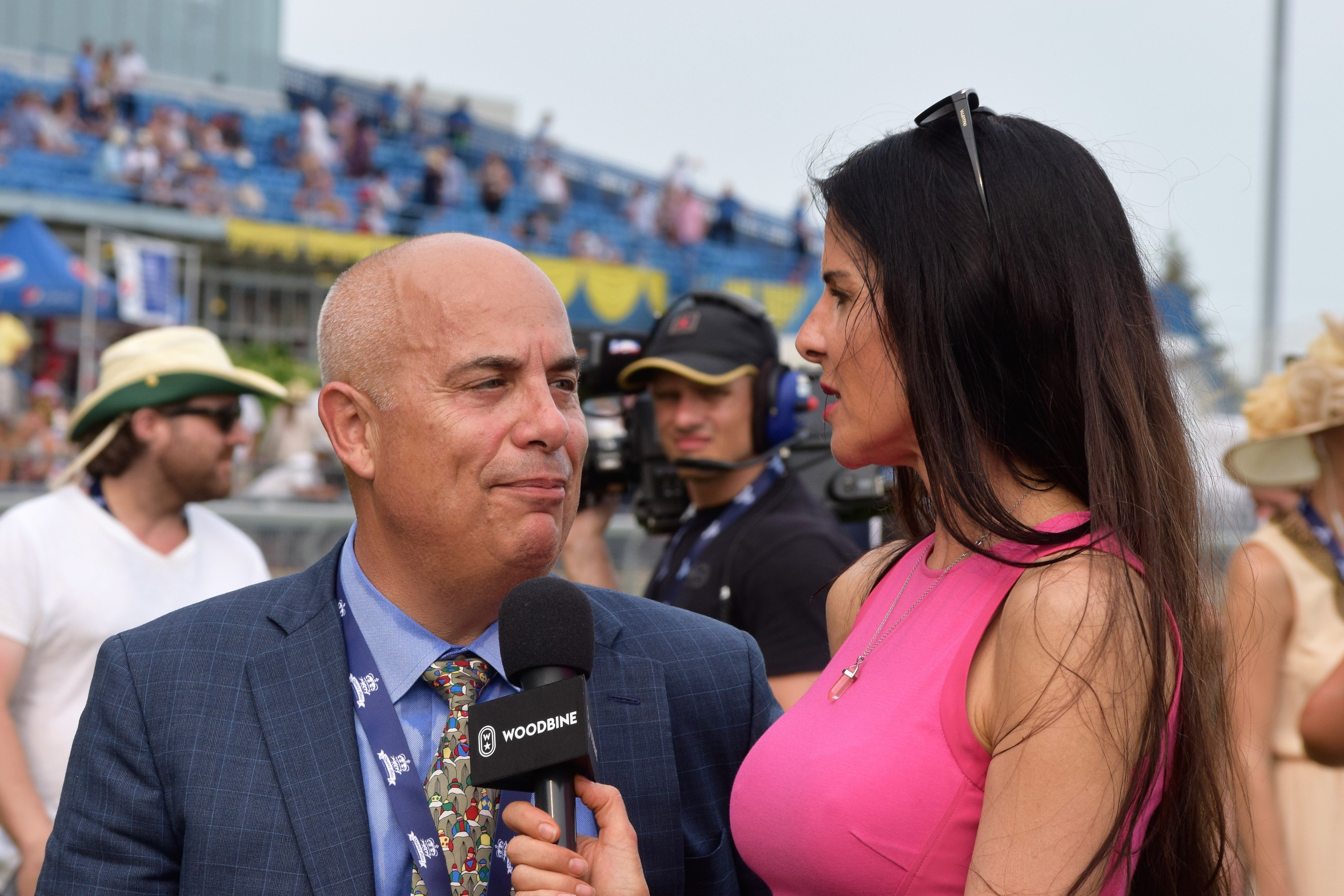 Dawn Lupul interviewing leading trainer Mark Casse at Woodbine. Photo: Will Wong