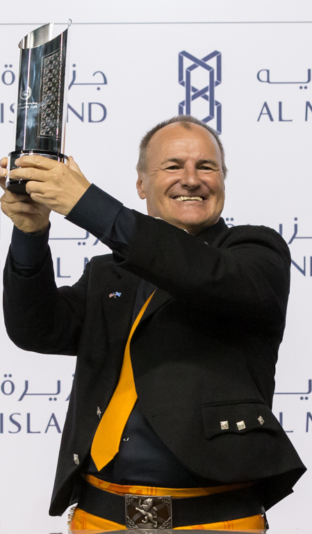 “I’ve never been so happy with a horse.” Bev Hendry with the trophy after Riflescope’s victory at Meydan in February. Photo: Dubai Racing Club/Erika Rasmussen