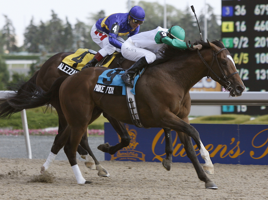 Golden moment: Emma-Jayne Wilson winning the 2007 Queen’s Plate on Mike Fox. “When I was past the leader everything disappeared, nothing left but the wire. It was surreal,” she says. Photo: Michael Burns