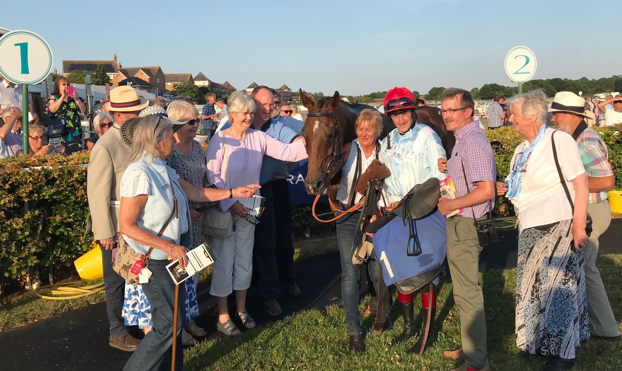 Members of the Foxtrot Racing Syndicate with their hero at Stratford