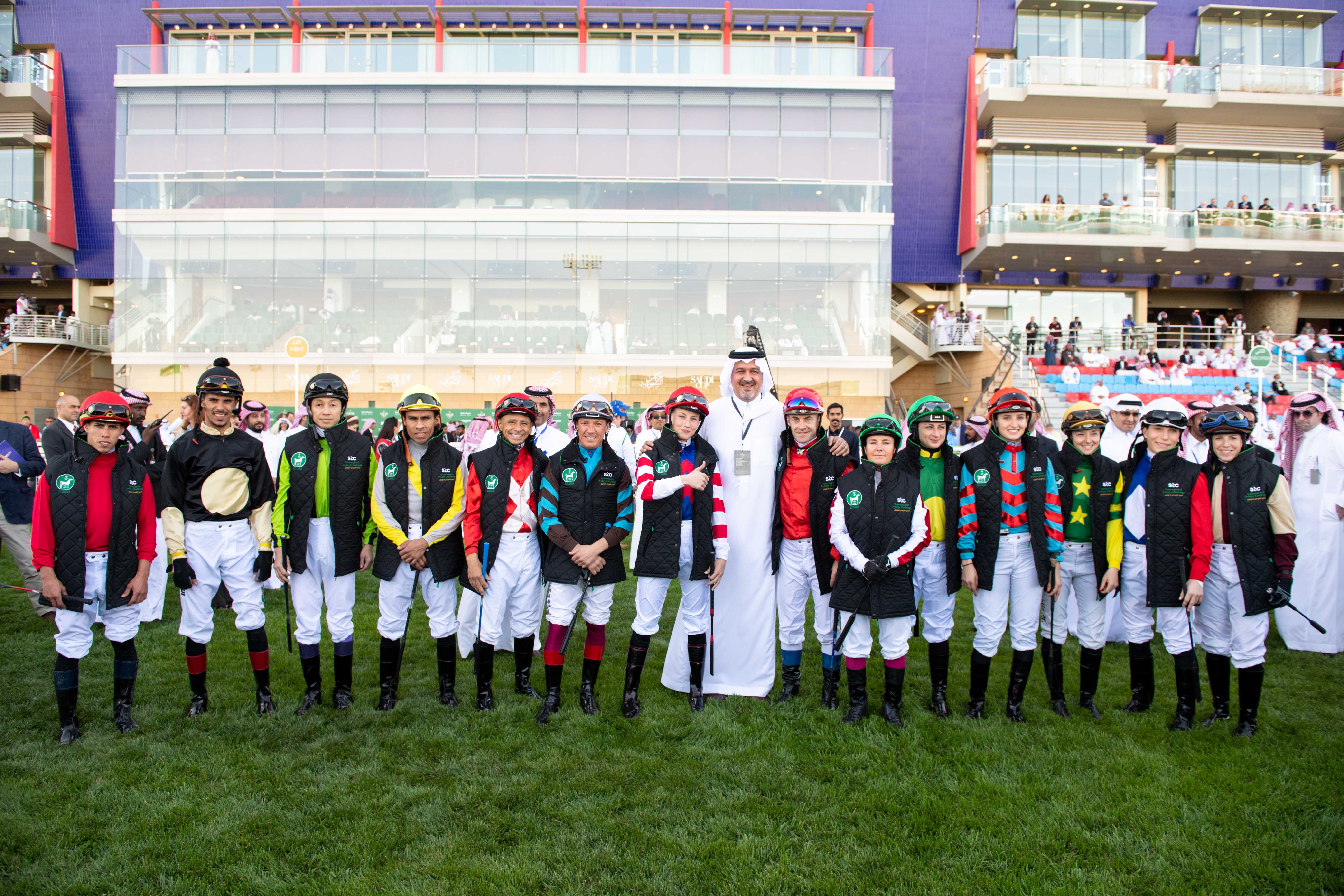 All-star line-up: Prince Bandar with the seven men and seven women riders who took part in the jockey challenge. Photo: Jockey Club of Saudi Arabia/Doug DeFelice