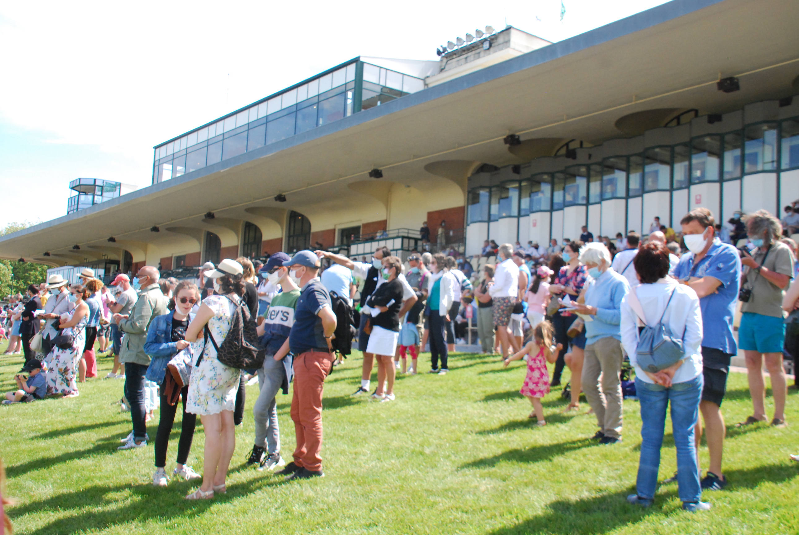 Back on track: Spectators in front of the stands for the Prix Jean Prat meeting at Deauville last Sunday. They were required to wear face masks as France reopened racecourses to the public. Photo: John Gilmore