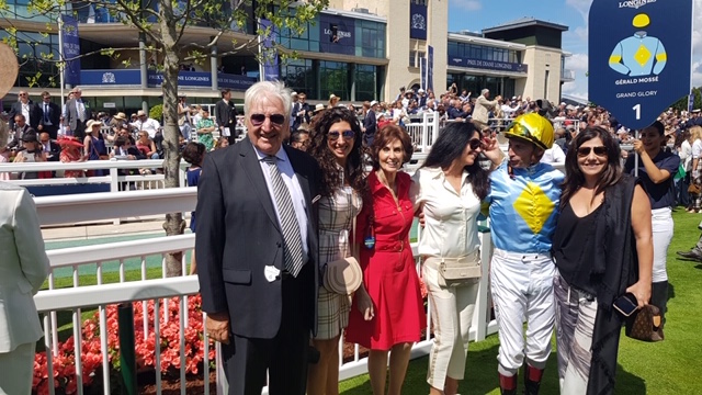 John D’Amato with his family and jockey Gerald Mosse at the Prix de Diane at Chantilly last year