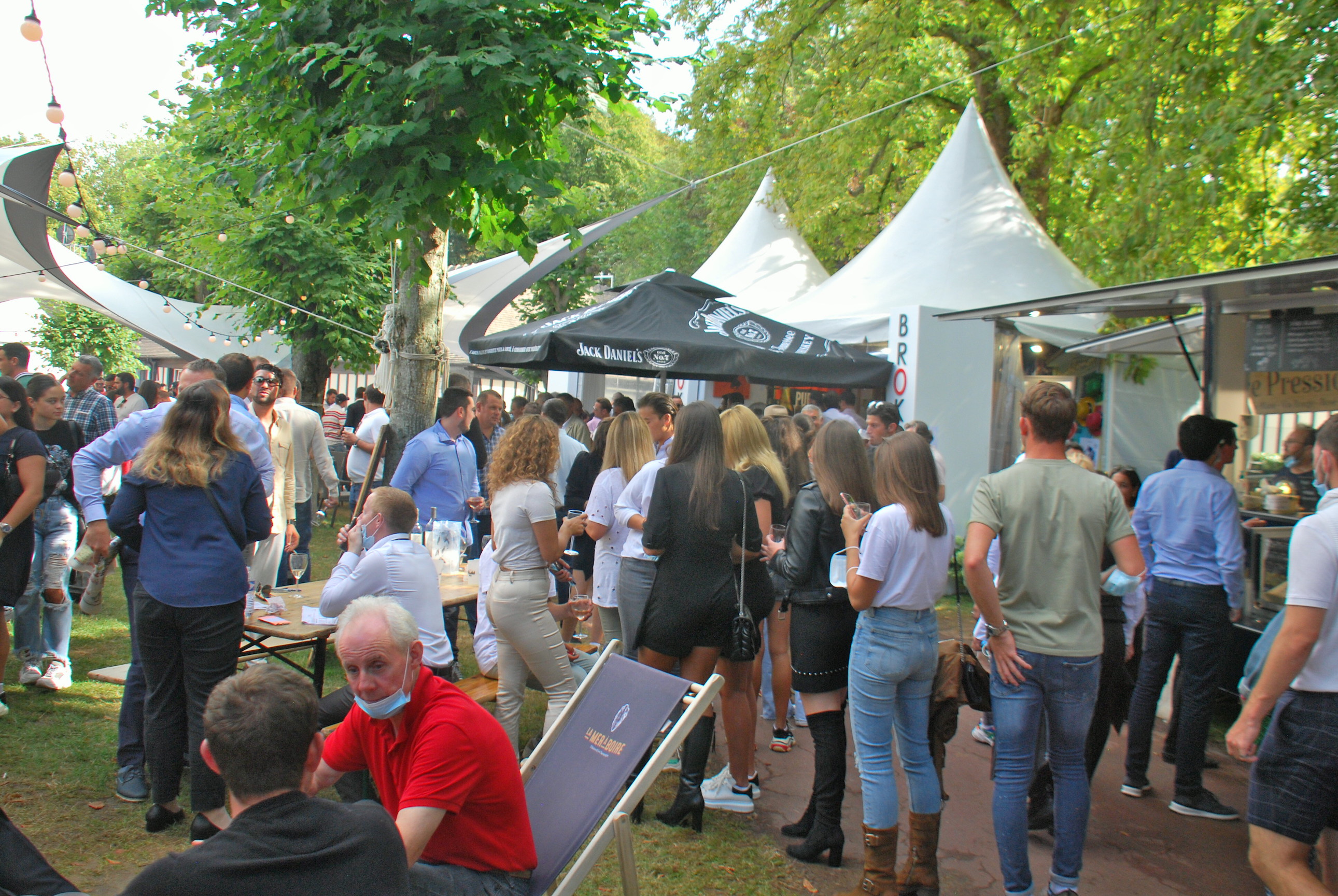 Racegoers enjoy the leafy sunshine with few restrictions on raceday at Deauville on August 23. Photo: John Gilmore