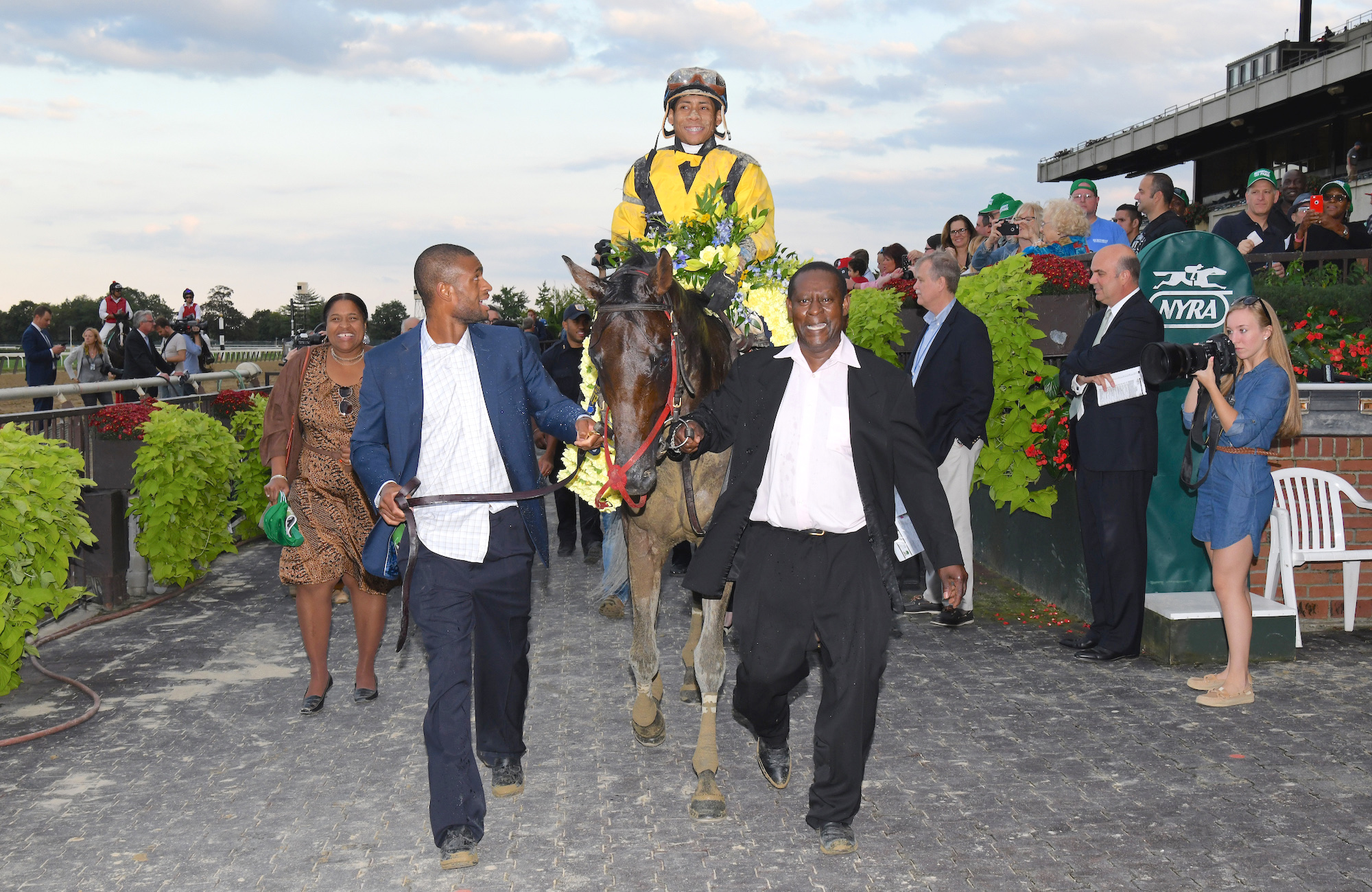 Grade 1 glory: Uriah St Lewis (right) and his son Uriah Jr. lead in Discreet Lover after his victory in the Jockey Club Gold Cup at Belmont Park in 2018. Photo: NYRA.com