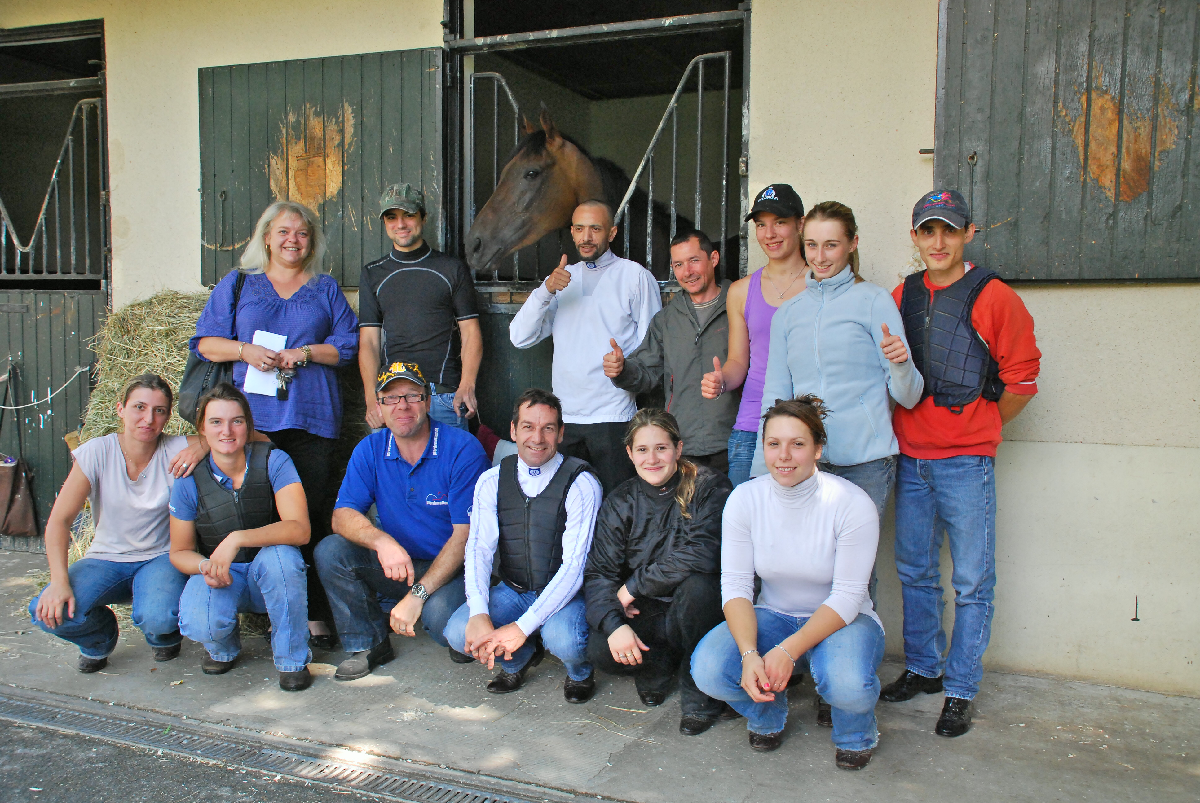 Don’t get too close! Freddy Head’s son Christopher (black shirt) is anxious not to get too close to Goldikova in this shot of the mare with stable staff in August 2011. Photo: John Gilmore
