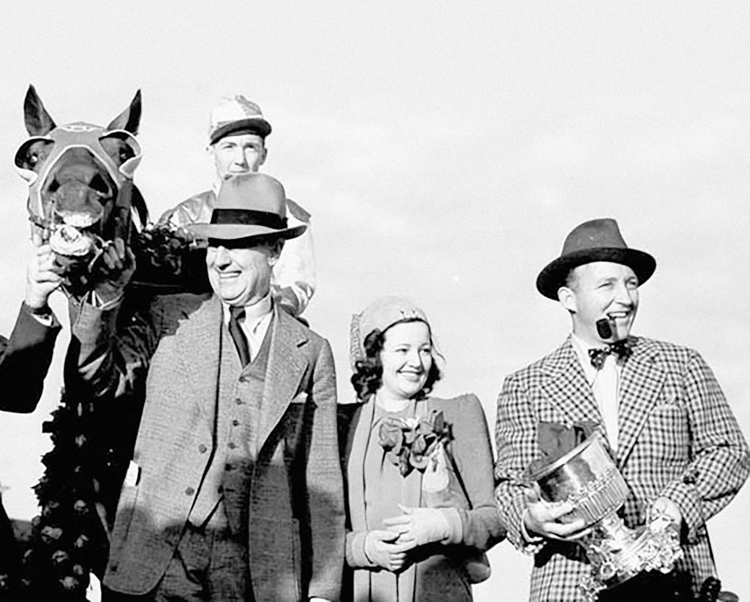 Seabiscuit after winning at Agua Caliente in Mexico in 1938 with Charles Howard and Bing Crosby, who is holding a trophy later stolen but recovered 60 years later by the FBI
