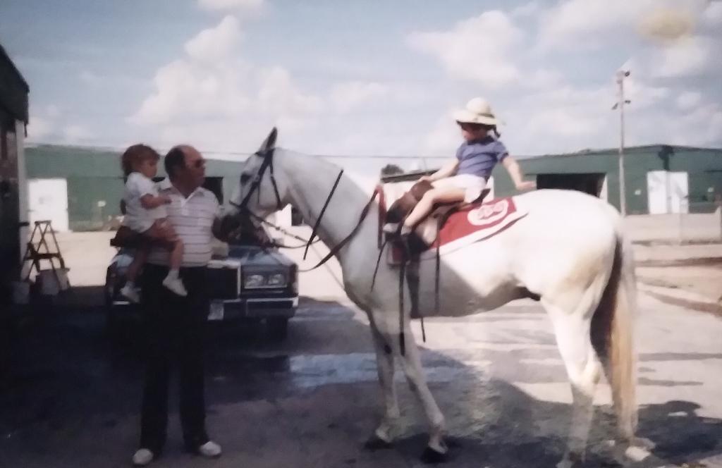 On horseback so soon: Pajeen the toddler with her father, Buddy Delp, and little brother Cleve