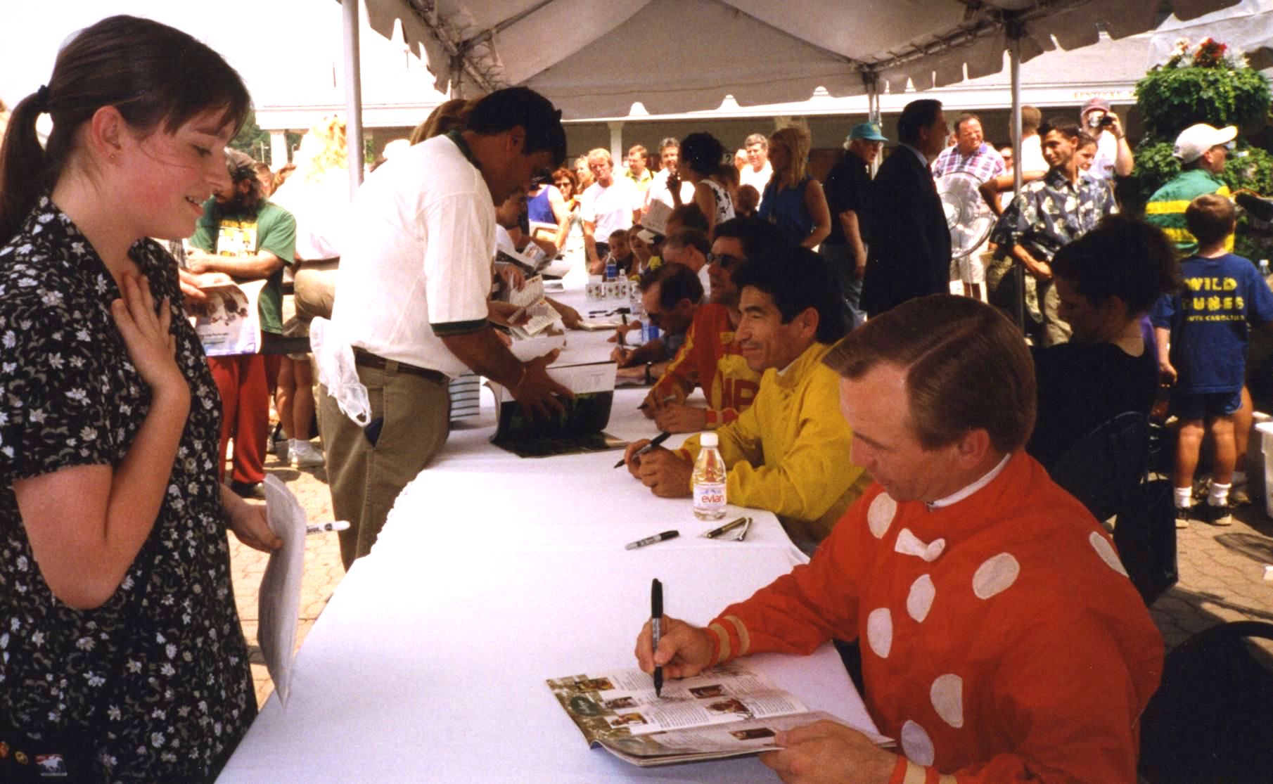 Meeting your heroes (1): a young Kate Hunter gets Pat Day’s autograph at Churchill Downs. Photo supplied