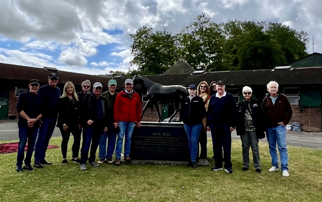 Mill Reef meeting: Team Valor visitors beside the great Derby winner’s statue at the Kingsclere base of trainer Andrew Balding (red jacket); next to him is Team Valor principal Barry Irwin (green cap) and Clark Spencer. Photo supplied