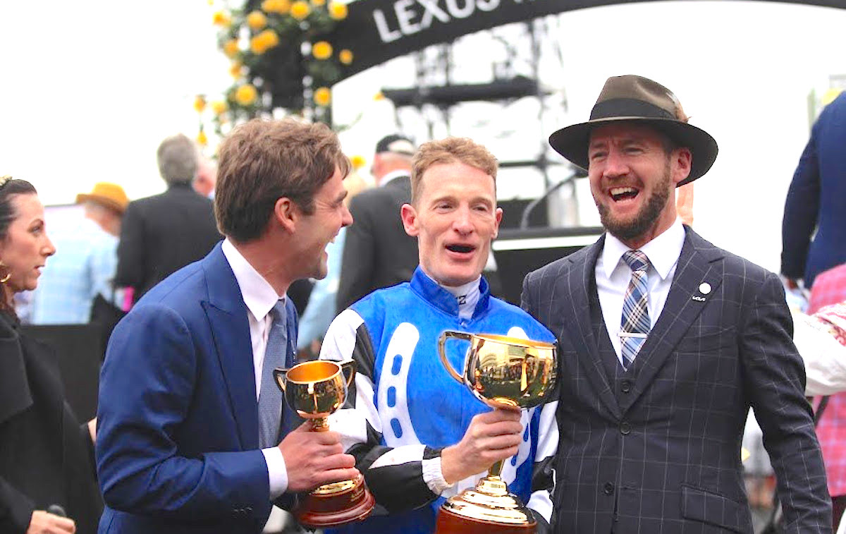 Cup winners: Gold Trip co-trainers David Eustace (left) and Ciaron Maher (right) in high spirits with jockey Mark Zahra after winning the Melbourne Cup. Photo: Kristen Manning