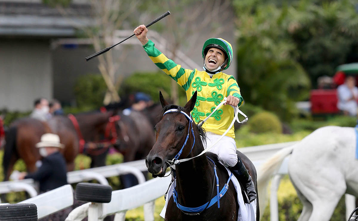 A jubilant Joao Moreira celebrates after winning the 2021 BMW Hong Kong Derby on Sky Darci. Photo: HKJC