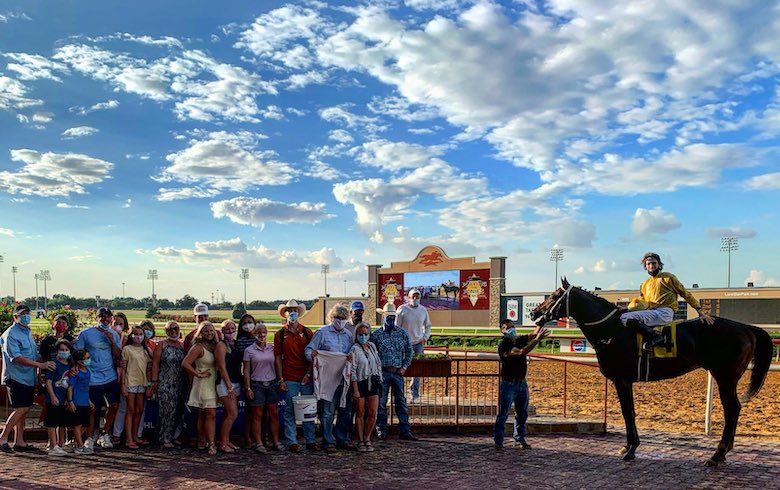 Enjoying the moment: family and friends in the winners’ circle after Keith’s first victory. Photo: Lone Star